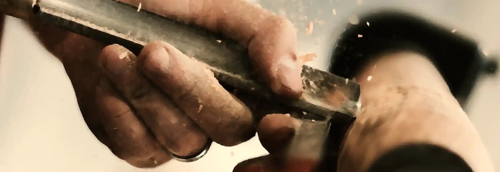 A craftsman carving a chess piece from wood